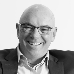 Black and white picture of bald man and glasses 